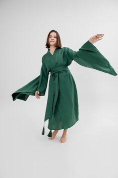 This exquisite Japanese kimono dress is the perfect gift for the woman in your life - whether it's your girlfriend or wife. Crafted from high-quality linen, this long jacket doubles as a coat, making it the ideal piece for any occasion. This organic loungewear piece boasts a maxi length and boho-inspired design, making it a stylish addition to any wardrobe. Embrace eco-friendly fashion with this minimalistic linen robe, offering both comfort and sustainability in one beautiful garment. Wrapped d Green Dresses For Tea Ceremony, Elegant Green Wrap Kimono, Long Sleeve Green Robe For Fall, Fitted Green Spring Kimono, Green Fall Kimono With Kimono Sleeves, Traditional Green Kimono For Spring, Green Cotton Robe For Spring, Green Fall Kimono, Green Wrap Kimono For Fall