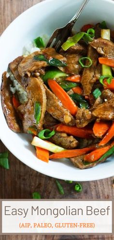 a white bowl filled with meat and veggies on top of a wooden table