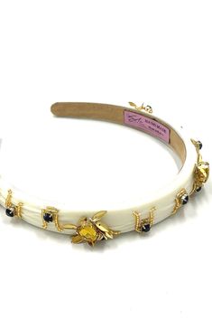 Soho Style Busy Bee Headband This exquisite headband features stunning golden bee inlays, adding a touch of whimsy and elegance to your look. Crafted from a soft yet sturdy material, the headband ensures comfort while securely holding your hair in place. The intricate bee designs, delicately detailed in shimmering gold, create a striking contrast against the band, making it a standout accessory. Perfect for both casual outings and special occasions, this headband effortlessly combines style and Bee Headband Grasshoppee, Bee Headband, Hair Care Kit, Organic Conditioner, Highlighted Bangs, Teasing Comb, Soho Style, Bee Designs, Bobby Pin Hairstyles