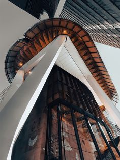 the side of a tall building that has a clock on it