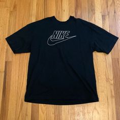 Nike T Shirt, Size M. Never Worn Nike Cotton T-shirt For Streetwear, Black Nike Cotton T-shirt, Nike Graphic Tee With Text Print, Black Crew Neck T-shirt With Logo Print, Nike Black T-shirt With Letter Print, Nike T-shirt With Text Print And Crew Neck, Black Nike T-shirt With Letter Print, Nike Short Sleeve T-shirt With Graphic Design, Nike Graphic Design Short Sleeve T-shirt