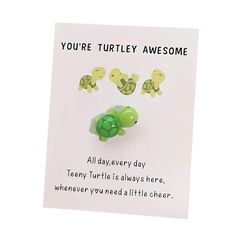 there is a card with some little turtles on it