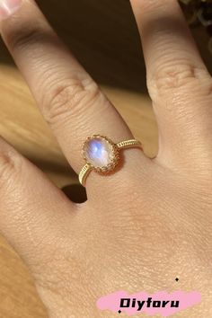 Illuminate your style with the Lunar Radiance Ring. Its captivating moonstone emits a gentle, otherworldly glow that mirrors the soft radiance of a full moon, making it the perfect accessory for those who appreciate subtle yet striking elegance. #ring#wirewrap#jewelry#wirejewelry#Diyjewelry#handmadejewelry#DIYring#wire work#moonstone#diygifts Dainty Adjustable Moonstone Crystal Ring, Adjustable Mystical Moonstone Ring With Natural Stones, Adjustable Dainty Crystal Moonstone Ring, Adjustable Dainty Moonstone Crystal Ring, Dainty Handmade Moonstone Ring Gift, Delicate Adjustable Moonstone Ring As Gift, Handmade Dainty Moonstone Ring For Gift, Handmade Adjustable Moonstone Crystal Ring, Handmade Adjustable Spiritual Moonstone Ring