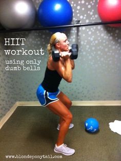 a woman is doing an exercise with dumbbells in front of her and the words hit workout using only dumbbells