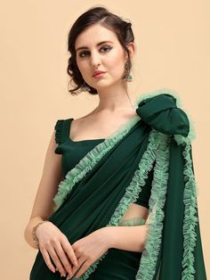 Irresistible bottle green ruffled border saree online for women which is crafted from georgette fabric and comes with georgette blouse. Ruffled Georgette Saree With Traditional Drape, Ruffled Georgette Saree In Traditional Drape, Festive Green Ruffled Saree, Green Georgette Blouse With Traditional Drape, Green Georgette Saree With Ruffles, Traditional Drape Green Georgette Blouse, Green Georgette Pre-draped Saree With Traditional Drape, Green Georgette Pre-draped Saree, Green Ruffled Saree For Wedding