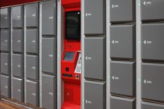 an atm machine in front of several lockers with arrows pointing to the left and right