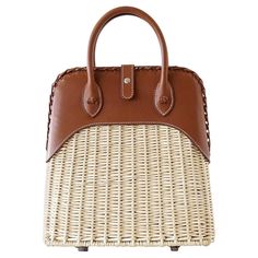 Mightychic offers a rare to find Limited Edition Hermes Picnic Bolide. Light weight wicker and the warmth of Barenia leather. The ultimate chic bag for any summer day - dress her up or down. Top has a beautifully braided edge. Front closure is the instantly recognizable palladium Clou De Selle. Handle base accented with flower knots. Comes with sleeper and signature Hermes box. NEW or NEVER WORN final sale mightychic offers an exquisite and unique array of Hermes. With a long and storied history Hermes Limited Edition, Hermes Bolide, Picnic Bag, Chic Bags, Hermes Handbags, Burberry Handbags, Basket Bag, One Bag, Hermes Bags