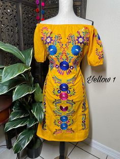 "Beautiful Floral Embroidered Dress - Handmade Embroidered Mexican Dress - Artisan Made Dress Beautiful hand embroidered dress! This has been made and brought directly from Puebla, Mexico. The dress has extremely detailed embroidery. The embroidery is 100% handcrafted. All the work on this dress has a professional skilled finish and the multicolor embroidered makes it look even more eye catching. The embroidery work is made with great quality thread. The eye catching will be on the embroidered w Traditional Dress With Multicolor Floral Embroidery, Folk Dresses With Multicolor Resham Embroidery, Folk Style Dresses With Intricate Multicolor Embroidery, Folk Style Dresses With Resham Embroidery, Festive Multicolor Geometric Embroidered Dress, Festive Multicolor Geometric Embroidery Dress, Summer Festival Floral Embroidered Fabric, Festive Dresses With Floral Embroidery, Yellow Embroidered Dresses For Festive Occasions