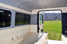 the inside of a camper with its door open