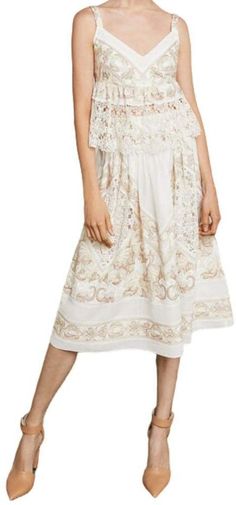 Designed with a flattering sweetheart neckline, this sleeveless, lingerie-inspired top in floral filigree on cotton voile is embellished with an ornately embroidered hemline.Concealed center back zipper and hook-and-eye closuresAdjustable spaghetti strapsFabric Self: 100% cotton filigree floral embroidered voile;Lining: 100% polyester crepe de chineHand wash Embroidered Bohemian Lace Top For Summer, Feminine Cotton Lace Top For Spring, Feminine Lace Patchwork Top For Summer, Floral Embroidery Lace Top For Summer, Feminine Lace Top With Lace Patchwork For Summer, Chic Summer Cotton Lace Top, Floral Embroidered Lace Top For Summer, Fitted Embroidered Lace Top For Summer, Elegant Summer Cotton Lace Top