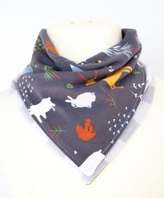 a gray bandana with farm animals on it