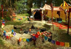 an outdoor area with several tents and flags