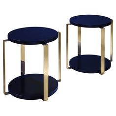 two blue tables with gold bases on white background