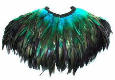 a green and black feathered shawl on a white background