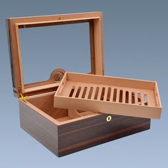 an open wooden box with the lid opened