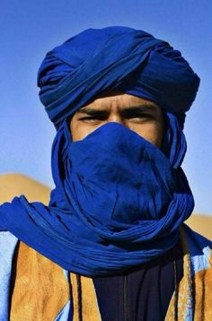 a man with a blue turban on his head