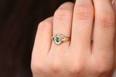 "Emerald Signet Ring in 14k Gold / Baguette Emerald Pinky Ring / Gold Pinky Ring Features *Made to Order. *Gold Kt: 14K *Custom Gold Color: Rose Gold, Yellow Gold, White Gold *Baguette Emerald: 1pcs 4.2x 2.3MM *Total CTW: 0.15ctw *Setting Type: Bezel *Width of Band: Graduates from 7.5MM to 2MM *Center Oval: 10.00mm x 8.5mm *Ready to Ship in 7-10 Business Days Be sure to hit \"favorite\" on the right so it remains on your favorites list and/ or add to your wish list(s). ▶ Want to find out more? C Emerald Signet Ring, Pinky Ring Gold, Gold Pinky Ring, May Birthstone Rings, Emerald Rings, May Birthstone, Platinum Ring, Pinky Ring, Emerald Ring