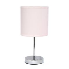 a lamp that is on top of a metal base with a pink shade over it