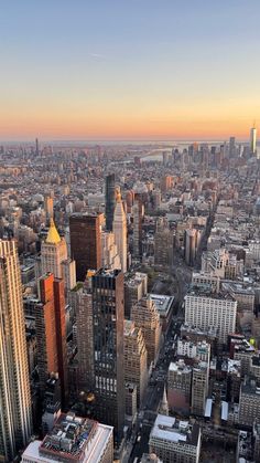 an aerial view of new york city at sunset