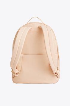 the back view of a backpack with straps on it, in light pink leather and white canvas