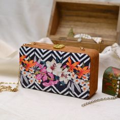 This is a beautiful printed clutch bag.It's stylish floral print with flowers makes it perfect for everyday wear.It comes with a metal sling chain. Details - Both side printed - Fabric lining on the inside to keep your belongings safe - Cushioning on printed sides - Metal lock closure - Detachable sling chain This clutch can be worn as a crossbody bag or a shoulder bag with the sling chain or can simply be carried in hand.It is spacious enough to carry mobile phones, lipsticks, Keys and other sm Bridal Clutches, Handmade Clutch, Gift Girlfriend, Faux Suede Fabric, Printed Clutch, Bridal Clutch, Handmade Gifts For Her, Simply Be, Girlfriend Gift