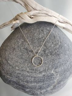 "This beautiful necklace has a handmade tiny sterling silver circle. Perfect to wear every day. The circle measures 10mm across and it hangs on a sterling silver chain with a sterling clasp. Shown in 17\" length, layered with our medium silver hammered bar necklace, available here: https://www.etsy.com/listing/506639121/sterling-silver-bar-necklace-medium?ref=shop_home_active_1 Also available in gold as shown in the last photo. *If you are unsure of the length you need, or would like to wear thi Everyday Sterling Silver Nickel-free Charm Necklaces, Everyday Sterling Silver Nickel-free Charm Necklace, Everyday Nickel-free Charm Necklace With Round Pendant, Nickel Free Round Pendant Charm Necklace, Everyday Nickel-free Round Pendant Charm Necklace, Everyday Sterling Silver Round Charm Necklaces, Everyday Round Sterling Silver Charm Necklace, Dainty Sterling Silver Round Disc Charm Necklace, Sterling Silver Round Jewelry With Silver Chain