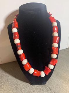 Handcrafted Red Bamboo Coral & White Howlite beaded necklace with a bronze lobster claw closure. This one-of-a-kind necklace measures 20 inches. Red Bamboo Coral gets its name from its similarity to bamboo stalks. It promotes creativity and prosperity. Howlite is known to promote inner peace and to calm emotions during times of change. Please note: stones may appear slightly different when viewed in different lighting. Unique Red Coral Beaded Necklaces With Large Beads, Red Coral Necklaces With Large Beads As Gift, Unique Red Coral Beaded Necklace As Gift, Unique Red Beaded Necklaces With Gemstone Beads, Gift Red Coral Necklace With Large Beads, Red Coral Necklaces With Large Beads For Gift, Red Gemstone Beads Necklace, Red Coral Necklace With Large Beads For Gift, Adjustable Single Strand Beaded Necklace In Red Coral