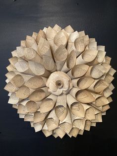 an origami flower made out of book pages