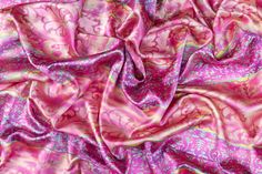 a pink and purple paisley print fabric