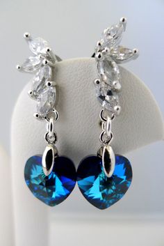 Peacock Wedding Earrings, Bermuda Blue Swarovski Crystal Earrings, Navy Blue Heart Earring, Bridesma Crystal Heart Earrings For Wedding, Elegant Crystal Heart Earrings For Wedding, Elegant Heart Crystal Earrings For Weddings, Heart-shaped Cubic Zirconia Crystal Earrings For Wedding, Crystal Dangle Heart Earrings For Wedding, Cubic Zirconia Heart Earrings For Wedding, Crystal Heart Cut Earrings For Wedding, Silver Heart Cut Crystal Earrings For Wedding, Blue Elegant Heart Earrings For Pierced Ears