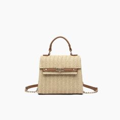 Meet the little sister to the 'Nova' Crossbody—Neo. Featuring a pastel monotone straw shell and lined with 100% polyester, this mini crossbody bag keeps it classic with a mostly straw body and minimal vegan leather detailing around the top handle and magnetic snap closure. Straw 7"W x 6.5"H x 3"D 13.20 oz 2.5" top handle 23" strap Magnetic snap closure Style# X4BY07 Spring Travel Crossbody Straw Bag, Trendy Summer Satchel With Single Handle, Trendy Straw Bag With Detachable Strap And Top Handle, Summer Top Handle Satchel With Detachable Handle, Chic Summer Satchel With Single Handle, Summer Beige Crossbody Satchel, Beige Crossbody Satchel For Summer, Spring Straw Crossbody Bag With Detachable Handle, Spring Straw Crossbody Shoulder Bag