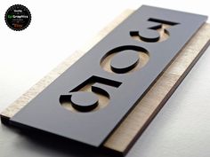 a wooden sign with the number forty five on it's front and back sides