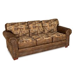 a brown leather couch sitting on top of a white floor