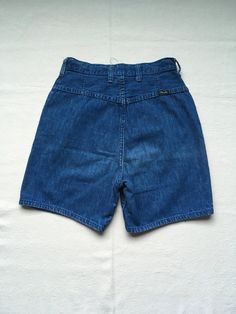 "1960s women's jean shorts Wrangler, made in USA snap top SCOVILL zipper denim cotton 2 front pockets 6 belt loops worn in to perfection denim has specks and lined patina pictures seem a bit dark measures, lying flat, waist- 12\" to 12 1/2\" (with a tug_ rise-12\" hip at bottom of J seam-18 1/2\" inseam-5 1/2\" hem-9 1/2\" out seam-16 1/2\"" Fitted Retro Denim Shorts, Retro Fitted Denim Shorts, Retro High Rise Denim Shorts, Retro High Waist Medium Wash Shorts, Retro High Waist Denim Shorts, Retro High-waist Medium Wash Shorts, Retro High-waist Denim Shorts, Retro Fitted Medium Wash Jean Shorts, Retro High Waist Medium Wash Jean Shorts