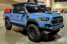 a blue truck parked inside of a building