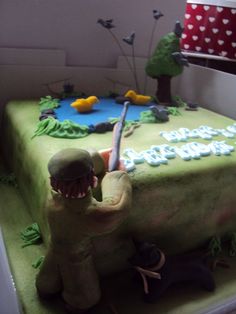 a green birthday cake with an army theme