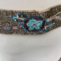 Vintage seed Beaded belt sash gold turquoise iridescent sequin fashion ITEM DESCRIPTION: Offering this fashion statement seed bead sequin sash belt.  This belt features tiny iridescent turquoise beads and sequin with gold tone seed beads formed in floral patterns.  The belt has two 10 inch gold colour ribbon tie ends. The tag reads: "The Limited. M/L. Face/Back: 100% Silk. Tie: 100% Polyester. Made in India. Dry Clean Only. Do not Iron". MEASUREMENTS: This classy belt measures approximately 33 i Gem Stone Belt, Vintage Adjustable Gold Belt, Gold Antique Buckle Vintage Belt, Adjustable Turquoise Vintage Belt, Adjustable Brown Beaded Belt, Fashion Corset, Beaded Belt, Sash Belts, Wardrobe Accessories