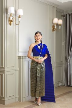 Our beautiful traditional Thai outfits are perfect for weddings, cultural events, Songkran festivals, or any occasion.  They are exclusively handmade with premium Thai silk & handwoven fabric. This set includes: 1 Free Size Silk Sabai Top 1 Free Size Patterned Skirt (can be worn with safety pins or hooks) 1 Set of hooks   This set does not include jewelry or accessories, they are available separately in our store. -- Check out our YouTube videos on how to wear your Thai dress: www.youtube.com/watch?v=jndYR-WrOuE www.youtube.com/watch?v=Eki5aUTxBBI&t=28s -- ชุดไทย, Thai attire, Thai costume, traditional Thailand clothing, that outfit, traditional Thai outfit, traditional Thai clothing, chut Thai, Thai wedding attire, Thai wedding dress, Thai traditional dress, Cambodian dress, Khmer dress, Blue Diwali Dresses For Traditional Ceremonies, Blue Dress For Traditional Ceremonies And Diwali, Blue Dresses For Diwali And Traditional Ceremonies, Royal Traditional Wear With Traditional Drape For Eid, Royal Traditional Wear With Drape For Eid, Royal Traditional Wear For Festive Ceremonies, Blue Traditional Wear For Ceremonies In Transitional Season, Royal Traditional Wear For Eid Ceremonial, Royal Traditional Wear For Eid Ceremonies