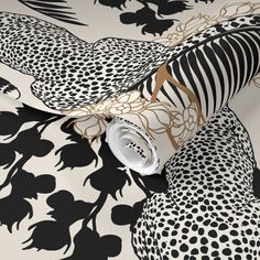 black and white wallpaper with an animal print pattern on the bottom half of it