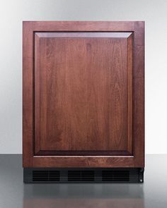 a wooden cabinet sitting on top of a counter