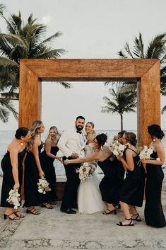 Beach wedding with the bridal party in black satin bridesmaid dresses Destination Bridesmaid Dresses, Black Satin Bridesmaid Dress, Bridesmaid Dress Inspiration, Beach Wedding Black, Black Bridesmaid Dress, Beach Wedding Bridesmaid Dresses, Beach Bridesmaids, Beach Wedding White, Beach Wedding Bridesmaids