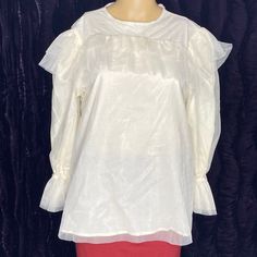 Ruffled Tulle Blouse Long Sleeve Ivory Color Size M #480 The Package Includes: 1 Blouse (Not The Skirt) Please Look At The Pictures The Pictures Are Not Professional Pictures Please See Listed Pictures For Full Details. Sold As Is. Comes As Is With What You See Pictures. What You See In The Picture Is What You Will Get. Chic Off White Tops For Wedding, Chic Off-white Tops For Wedding, Chic Off-white Wedding Tops, Cream Long Sleeve Wedding Top, Cream Long Sleeve Top For Wedding, Elegant Tops With Sheer Sleeves For Brunch, Cream Ruffled Top For Party, Elegant Puff Sleeve Blouse For Brunch, White Sheer Sleeves Top For Formal Occasions