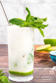 This refreshing Coconut Mojito is made with fresh cooling mint, coconut rum, coconut cream and club soda. A delicious and tropical cocktail for summer! Coconut Milk Cocktail, Coconut Drinks, Malibu Rum, Mojito Recipe, Light Rum, Rum Drinks, Coconut Rum