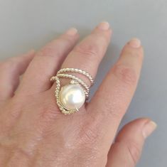 Modern, and stylish freshwater pearl ring. I totally hand create it. Check out for more pearl jewelry at my Etsy shop. Unique Handmade Pearl Ring For Formal Occasions, Silver Pearl Ring With High Luster, Classic Adjustable Pearl Ring, Elegant Handmade Adjustable Pearl Ring, Elegant White Wire Wrapped Pearl Ring, Elegant Adjustable Wire Wrapped Pearl Ring, White Pearl Jewelry, Cocktail Jewelry, Freshwater Pearl Ring