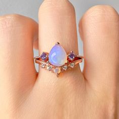 When it comes to the most stunning jewelry designs, we absolutely adore our gorgeous April Opal and Amethyst set. We've made each ring set with love by hand  using our premium sterling silver coated in real 14k gold and rose gold.  Finished with beautiful natural crystals, it's a design we know you will adore. ✦ DETAILS ✦ ✧ White fire opal and natural crystals  ✧ Sizes 3.75-11.25 ✧ This ring  will arrive ready to gift in a Kherish Jewelry Pouch. ✧ Due to the nature of the handmade process, each piece may slightly vary in color, size, shape, and contain natural inclusions. Every piece is gorgeous and one of a kind.  *Please refer to photos for reference.  ✦ This Artist Has Autism✦  Every item you order from Kherish is  handcrafted and packed by an artist with autism in RVA. Thanks to your s 20s Style Engagement Rings, Dainty Rose Gold Amethyst Wedding Ring, Rose Gold Amethyst Ring For A Gift, Rose Gold Amethyst Ring Birthday Gift, Yellow Gold Amethyst Crystal Promise Ring, Elegant Gold Amethyst Crystal Ring, Amethyst And Opal Engagement Ring, Opal And Amethyst Ring, Rose Gold Amethyst Birthstone Ring Gift