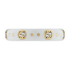 The Gucci Icon collection reprises one of the House's most emblematic motifs. The Interlocking G, representative of Founder Guccio Gucci's initials, is presented in 18k yellow gold, contrasting against a white synthetic corundum band. 18k yellow gold and white synthetic corundum Interlocking G engraving in gold .2" width This ring is a size 8 Made in Italy Gucci Style #: YBC679262002017 Gucci 14k Gold Designer Rings, Gucci Designer Rings In 14k Gold, Designer Gucci 14k Gold Rings, Elegant Gucci Yellow Gold Rings, Luxury Hallmarked Gucci Rings, Designer Yellow Gold Jewelry With Logo, Gucci Gold 14k Gold Rings, Classic Gucci Yellow Gold Ring, Gucci 14k Gold Rings