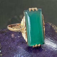 Antique chrysoprase ring in 9ct yellow gold, circa early 20th century. Set with a rectangular chrysoprase cabochon in its vibrant green colour. The rings setting is a particularly nice feature, there is a decorative detail to the longer sided gallery and three prong claws to the top and the bottom to ensure the stone is secure. The stone itself is in great condition with only a very small chip on one corner which is amazing considering its age. The stone is 16.6 mm x 7.1mm in size and inside the Chrysoprase Ring, Love And Forgiveness, Antique Boxes, Ring Art Deco, Art Deco Era, Green Colour, Vibrant Green, Yellow Gold Ring, New Love