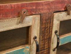 an old wooden cabinet with metal handles