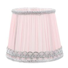 a pink lamp shade with silver trim