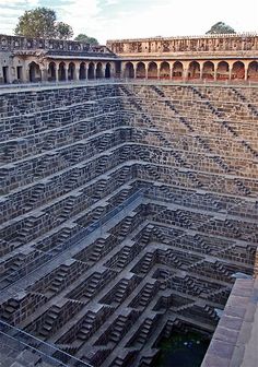 the inside of a large brick building with stairs leading up to it